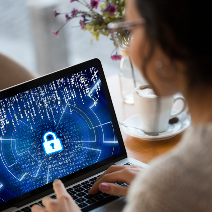 woman uses a laptop looking at a security screen